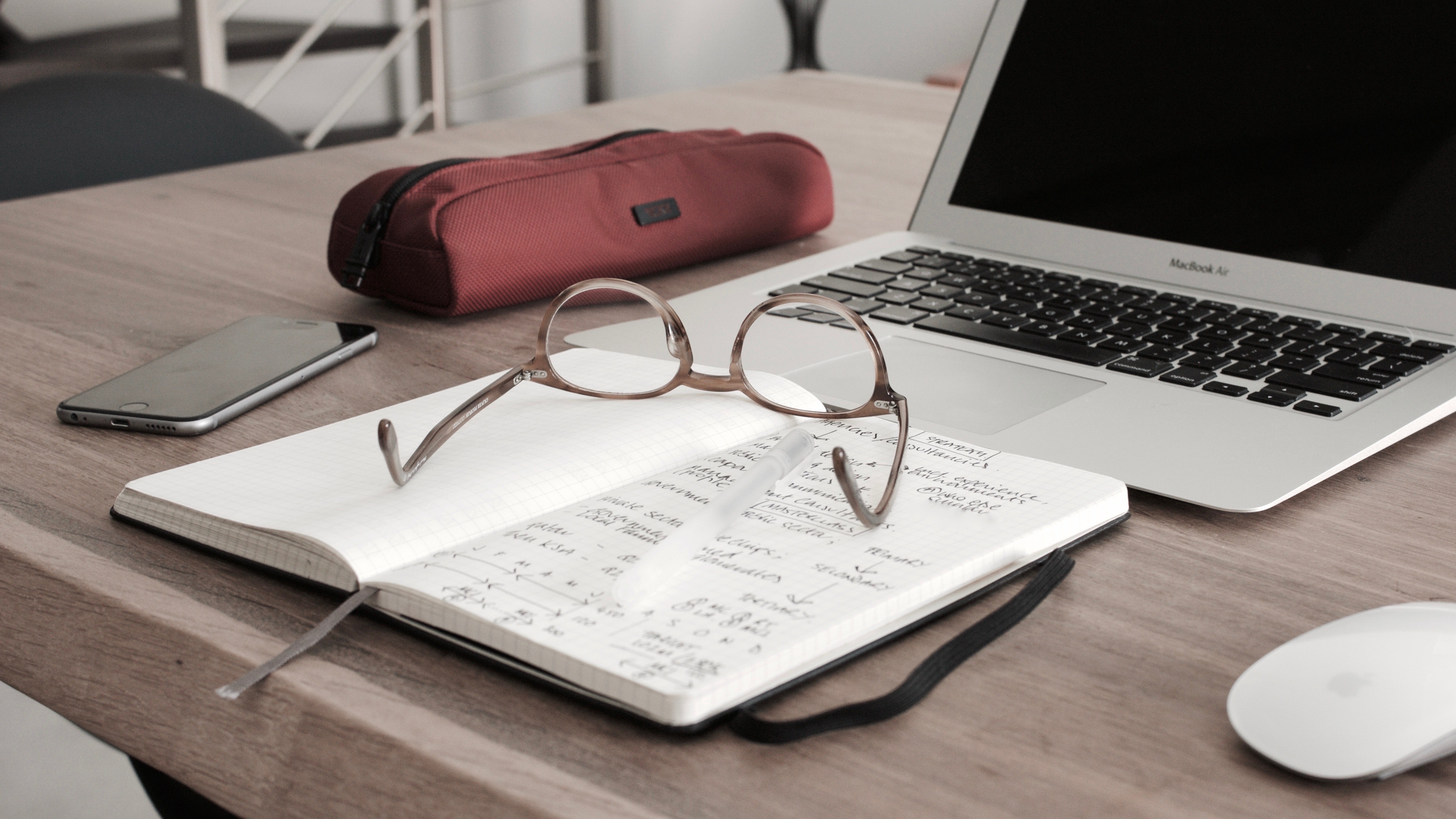 Glasses notebook and laptop, image by Dan Dimmock on Unsplash